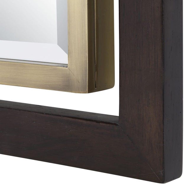 Suspended in ngative space this handsome mirror features indutrial GLAM with A bold, dark stained wood frame provides a...