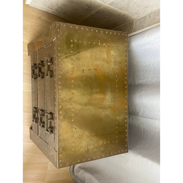Spanish High Style 'Strongbox' bedside table / commode with brass-clad exterior with natural patina, copper studs, and...