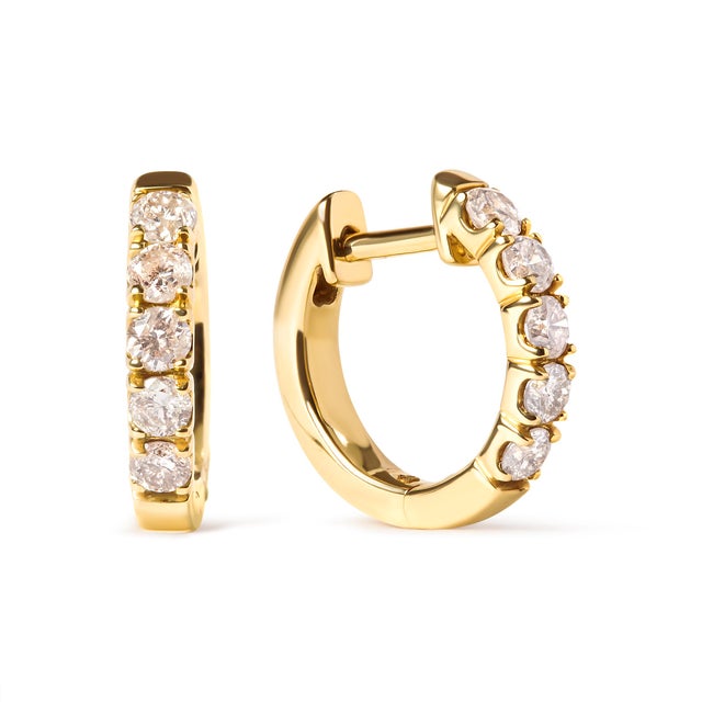 Indulge in the timeless elegance of these 10K yellow gold hoop earrings, a perfect addition to any jewelry collection....