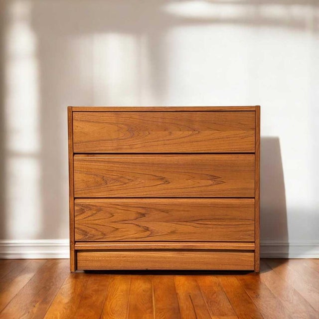 A beautifully scaled teak three-drawer chest with a warm, streamlined profile that works equally well as a petite dresser,...
