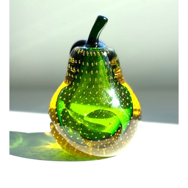 A beautiful and rare color on this set of Mid Century Modern Murano glass bookends in the shape of an apple and a pear. A...
