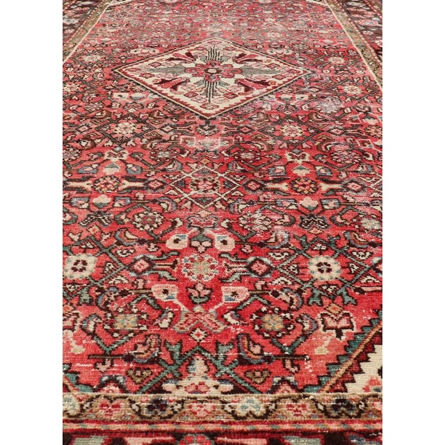 Persian Gallery semi antique Hamadan rug with medallion design in Soft red, brown, green and ivory. Rug country of origin...