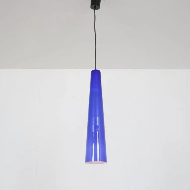 A beautiful large blue glass hanging lamp manufactured by Vistosi in Italy around 1960. I have official proof of...