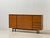 A large swiss mid-century highboard from the 1960s with clean, architectural lines and balanced proportions. The warm,...