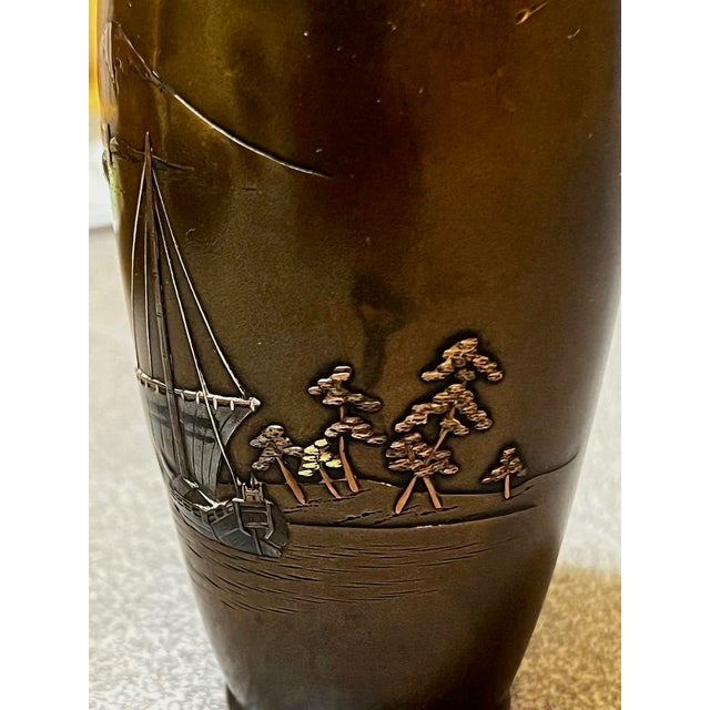 This exceptional Shakudo vase by Yamamoto Koken represents a masterwork of Japanese mixed-metal artistry. The composition...