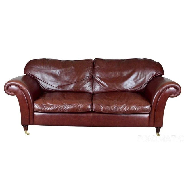 Lovely Laura Ashley, Mortimer II heritage brown leather three seat sofa with castors. The sofa is very comfortable and in...
