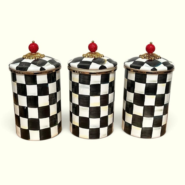 Set of 3 classic Courtly check pattern enameled metal canisters from Mackenzie Childs. Each stands at 9 3/4” tall. All new...