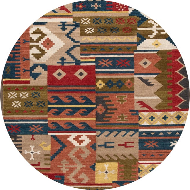 A beautiful hand-woven modern Kilim rug with a tan field and multi-color accents in an all-over geometric design. This rug...