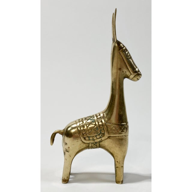 Vintage brass burro figure with long neck, perked ears and tail, and handsome detail. Lovely patina.