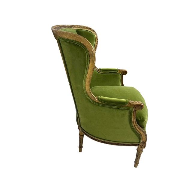 Early 20th or late 19th century Louis XVI Bergere wing chair in carved giltwood. High comfortable back with lovely foliate...