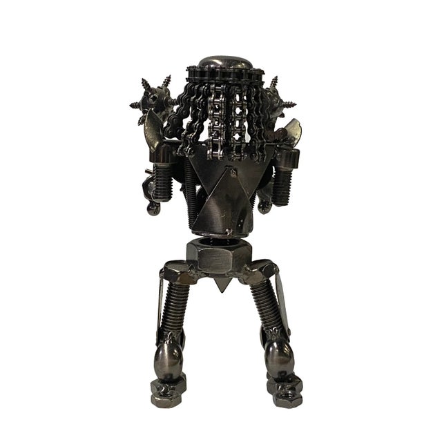 This is a modern display art figure made of metal in a pewter nickel silver color with a mechanical display. Dimensions:...