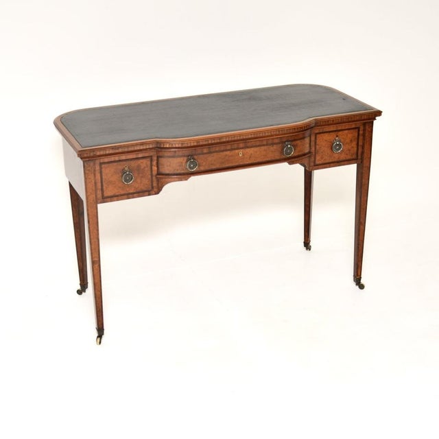 An outstanding antique Edwardian inlaid walnut desk / writing table. This was made in England, it dates from the 1900-1910...