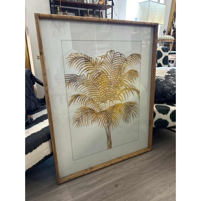 Vintage Golden Palm print framed in wooden frame designed to look like bamboo . Purchased at a local store in Colorado in...