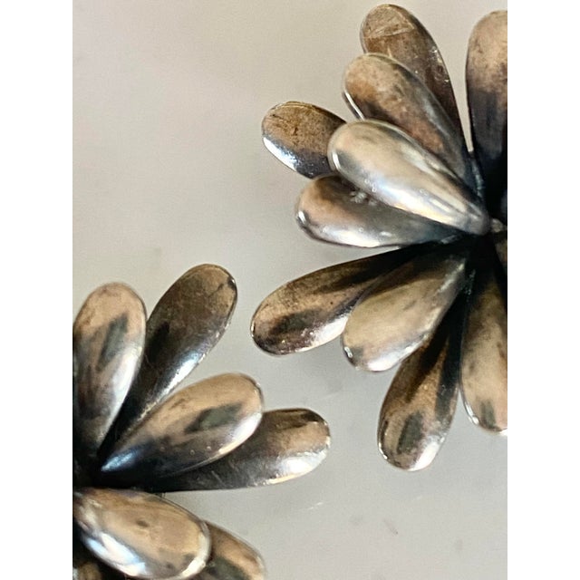Vintage 1950’s Sterling Silver Chrysanthemum 3-D Earrings. They are intricately designed with 3 whorls of petals. Each is...