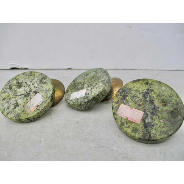 Set of three Votive candle spikes mounted on spotted green jasper stands. Charming little crowned lizards rest in the...