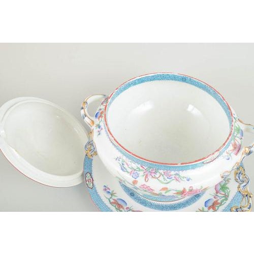 Minton, england large soup tureen with under plate, 1880s. Large faience soup tureen with matching under plate, richly...
