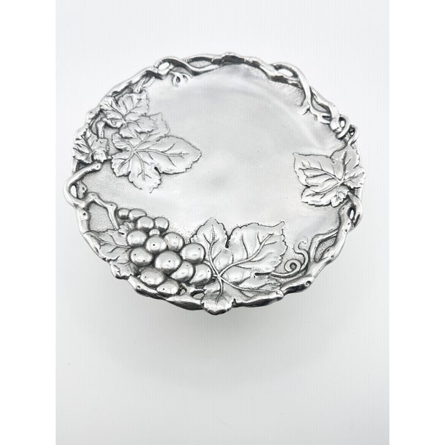 Lovely Arthur Court grape leaf/vine design cake stand. Made of aluminum. Perfect to use when entertaining. This is a pre-...