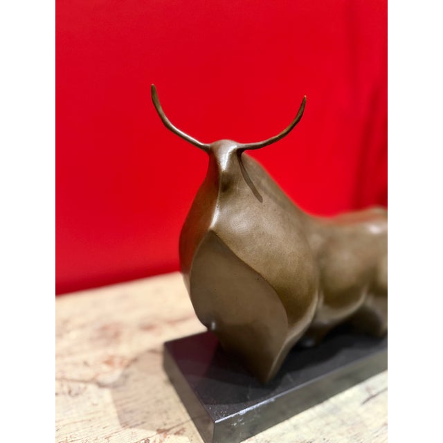 Vintage bronze sculpture on marble base. Wonderful form and execution of a proud bull. Excellent condition.