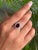 This stunning ring is meticulously handcrafted in 925 Solid Silver, showcasing a captivating oval Garnet gemstone of 4.34...