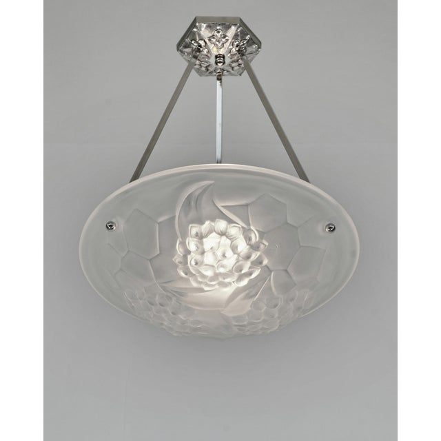 Degué A French art deco chandelier made around 1930 in nickel plated bronze or solid brass. The mounting holds a bowl by...