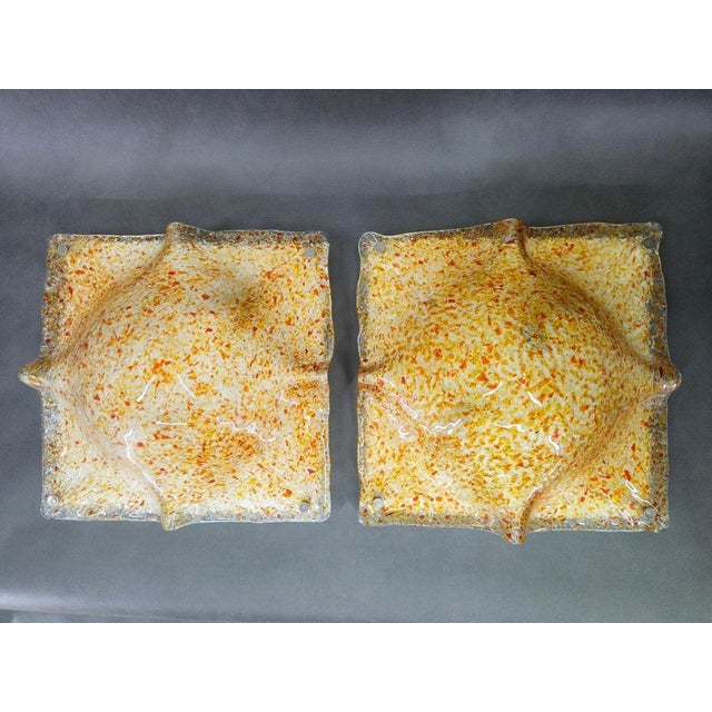 Exceptional pair of murano art glass wall sconces designed by toni zuccheri and produced by mazzega in italy during the...