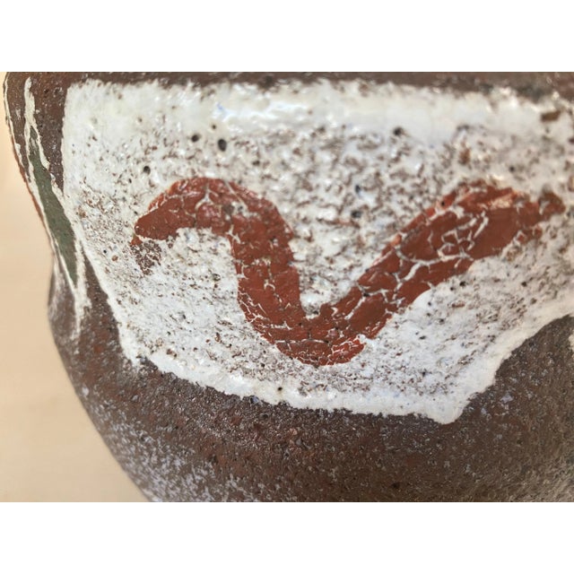 This vase or Pot was made in the 1960s in France by Les Potiers d'Accolay. Blue glaze on the inside and matte raw...