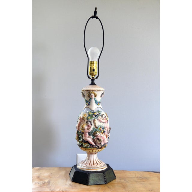 A richly detailed Capodimonte lamp, acquired by artist Tawny Chatmon with the intention of reimagining it within her...