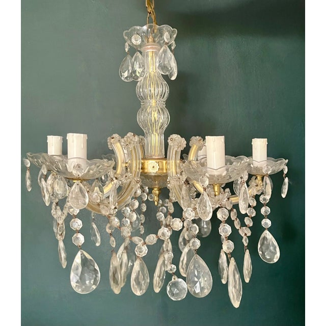 A stunning French Marie Therese 6 arm chandelier fully arranged with rock crystals and drops. Fully decorated with various...