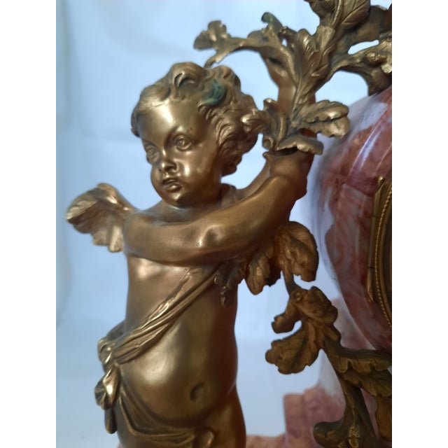 An extraordinary mid 19th-century French Louis XV style mantel clock, retailed and signed on the dial and movement casing...