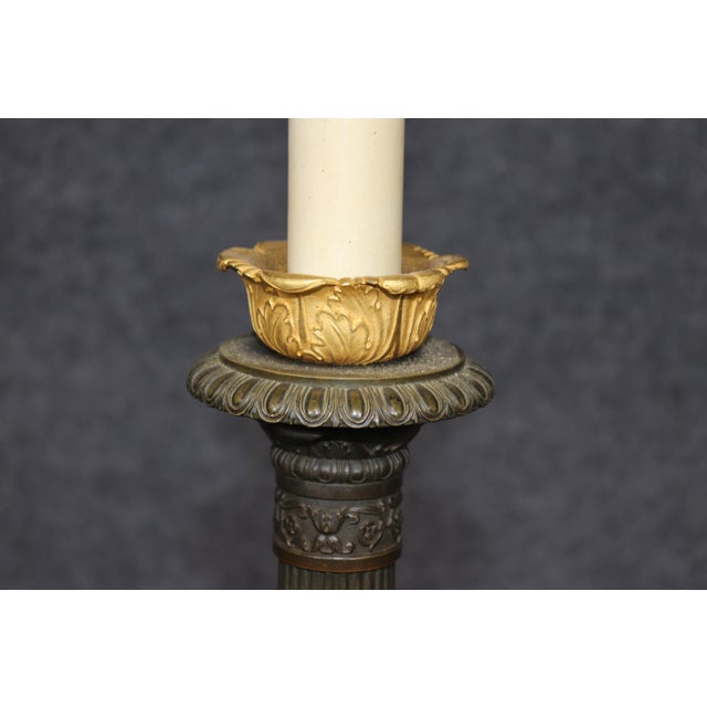 Pair of Late 19th/Early 20th Century Neoclassical Bronze Candlestick Lamps A handsome and substantial pair of late...