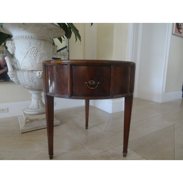 The Burnet Round side table is a timeless traditional inspired drum table with a beautiful flamed mahogany top and sports...
