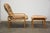 A mid century modern style oak bent plywood lounge chair and ottoman made by Brigger Furniture. Some discoloration seen in...
