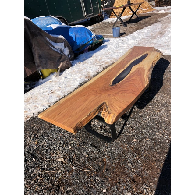 Striking organic butternut wood slab live edge coffee table having an irregular rectangular shape with gorgeous grain,...