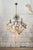 9-light chandelier with a chromed steel frame and glass crystals with rainbow-colored reflections. Designed by Gaetano...