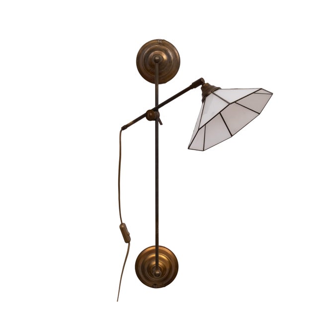 Very nice Brass Wall lamp . Adjustable in height ,sliding on a rail. comes with a Tiffany style shade . European Plug (up...