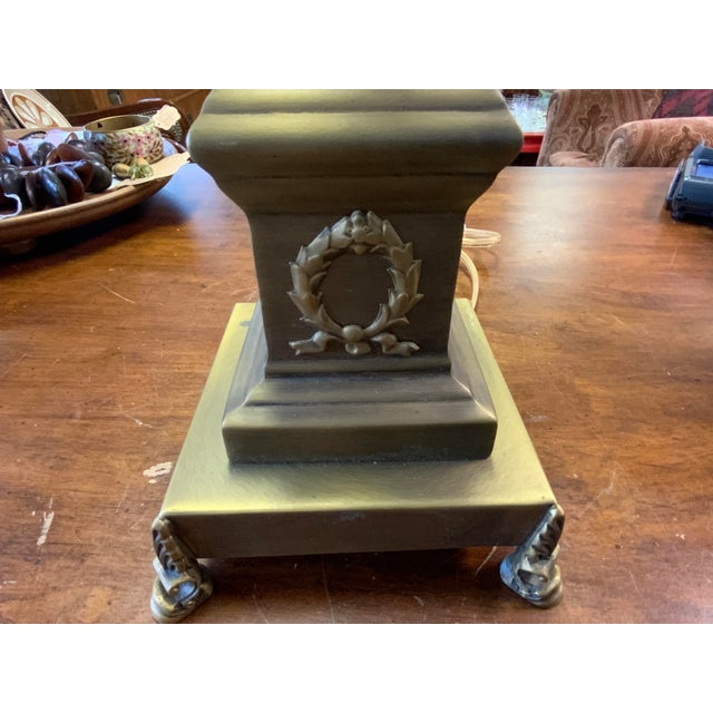 Late 20th century Bombay neoclassical lamp. Metal finish, adjustable height neck. 28” to 30.5”. Base to top of socket 22”...