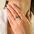 This elegant three-stone engagement ring features 1 marquise cut emerald totaling 0.93 carats, set in rich 18k white gold....