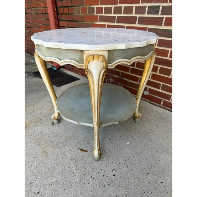 Crafted in Italy and completely transformed by Turtle and Crane, this exquisite two-tiered marble top accent table brings...