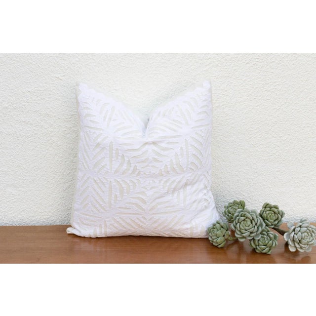 This decorative pillow cover features beautiful array of patterns, with hand crafted appliqué cut work, giving it a...