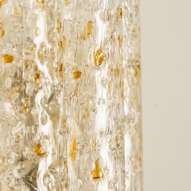 Wonderful set off hand blown Doria wall lamps. Manufactured in the 1960s. with textured and clear and amber spickled glass...