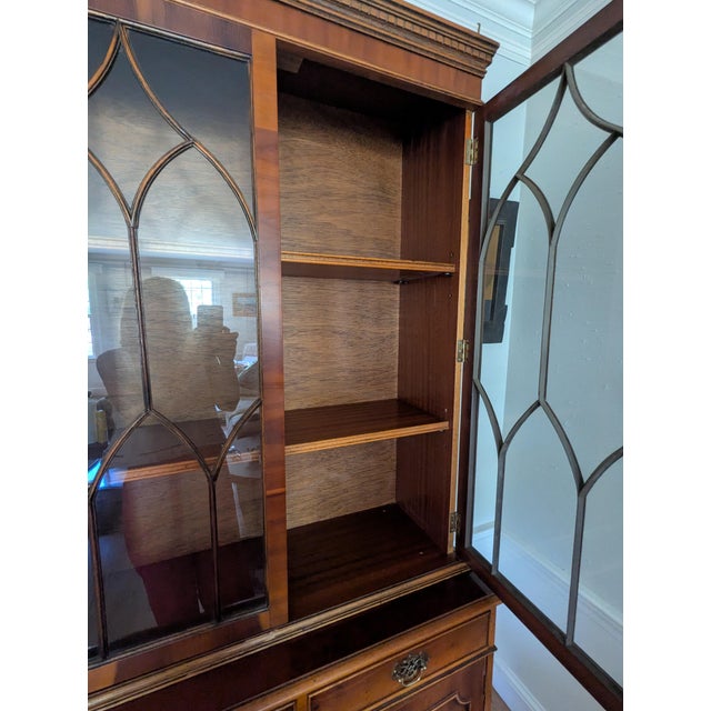 Southampton George III style bookcase. Solid wood, I believe mahogany with bookmatched veneer. Has glass doors on top with...