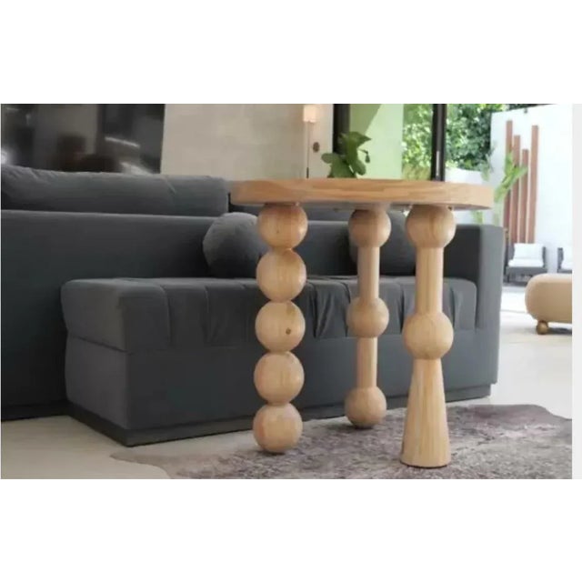 Modern wood round accent table with unique leg design with balls can be used as an entry way table, side table or a small...
