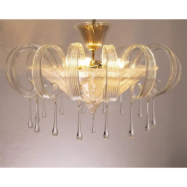 A great classic of italian design and at the same time a magnificent contemporary glass chandelier in murano mid-century....