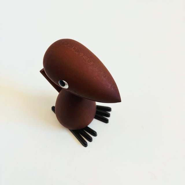 A mid century turned wood figurine in the shape of a Wood Pecker. Adorable stylized features. Made in Japan by Senshukai...