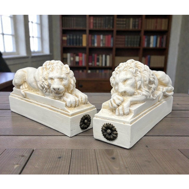 These classic recumbent lion bookends by House Parts, Inc. bring a refined architectural presence to a shelf or desk. Cast...