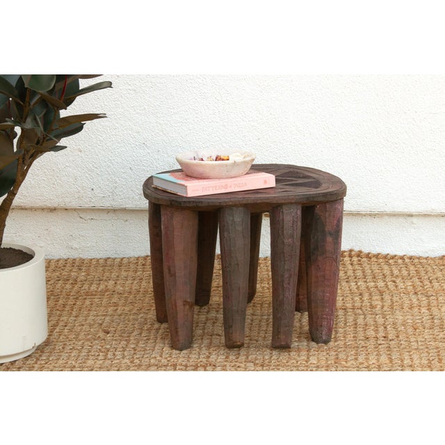 A unique piece of African art, this vintage Nupe table from Nigeria is a must-have for collectors and enthusiasts of Nupe...