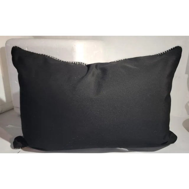 Mexican Indian weaving bolster pillow in an eye dazzler pattern.The insert is down Feather fill.