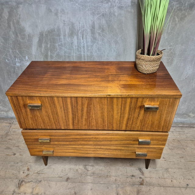 This mid-century chest of drawers dates to the 1970s and features the clean, balanced proportions characteristic of...
