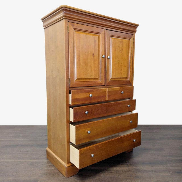 Made in the USA by Stanley Furniture, this versatile cherry-finished door chest features a spacious cabinet interior...