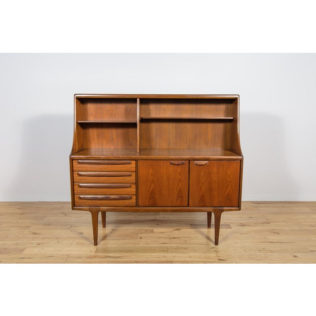 This is a Mid-Century highboard in teak designed by John Herbert for A.Younger Ltd in United Kingdom in the 1960s. This...